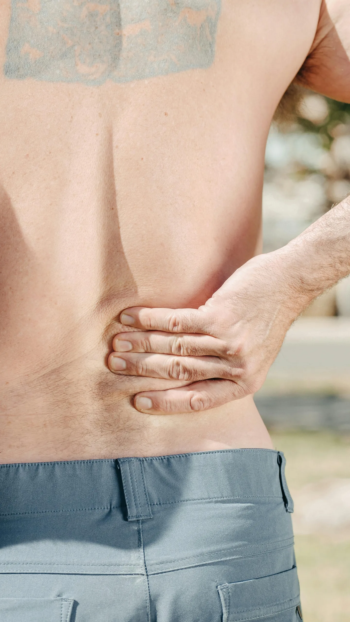 Man experiencing lower back pain